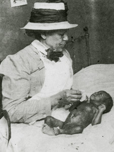African-american Nurse From Henry Street Settlement Visits Mother And Baby, Ca. 1910
