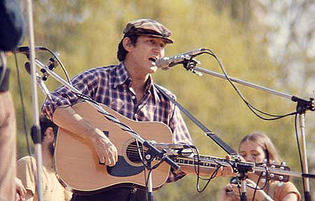 Phil Ochs Playing The Guitar. Image By Mark Sarfati, 1975, Courtesy Of Mark Sarfati. 